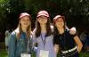 Three middle school students smiling